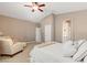 Bright and open main bedroom featuring a seating area, and neutral décor creating a calming space at 2025 Dakota Lodge Ave, Las Vegas, NV 89123