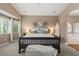 Comfortable carpeted main bedroom featuring a surfboard decor and neutral wall color at 2025 Dakota Lodge Ave, Las Vegas, NV 89123
