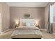 Well-lit main bedroom with cozy carpet, neutral tones, and a comfortable bed at 2025 Dakota Lodge Ave, Las Vegas, NV 89123