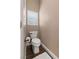 Cozy toilet room featuring a toilet, a window with blinds, and tile flooring at 2025 Dakota Lodge Ave, Las Vegas, NV 89123