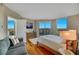 Inviting bedroom with wood floors, sitting area, and large windows showcasing city views at 222 Karen Ave # 3307, Las Vegas, NV 89109