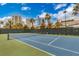Outdoor tennis court with a view of palm trees and Las Vegas buildings at 222 Karen Ave # 3307, Las Vegas, NV 89109