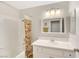 Bathroom featuring a tub and shower, a white vanity, and a large mirror at 2418 Antler Point Dr, Henderson, NV 89074