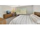 Bedroom featuring a large window, carpet, and a television on the dresser at 2418 Antler Point Dr, Henderson, NV 89074