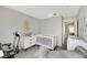 Bedroom with neutral tones, a crib, dresser, and a window view at 2418 Antler Point Dr, Henderson, NV 89074