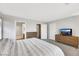Bright bedroom with carpet, television, and an ensuite bathroom at 2418 Antler Point Dr, Henderson, NV 89074