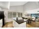 Open layout showcasing the kitchen island and dining area, seamlessly flowing into a cozy living space at 2418 Antler Point Dr, Henderson, NV 89074