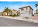 Charming two-story home featuring a well-maintained lawn, mature trees, and a spacious two car garage at 2418 Antler Point Dr, Henderson, NV 89074