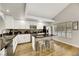 Modern kitchen with white cabinets, stainless appliances, kitchen island, and wood flooring at 2418 Antler Point Dr, Henderson, NV 89074