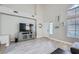Spacious living room has tile flooring and neutral paint, creating a blank canvas at 2418 Antler Point Dr, Henderson, NV 89074