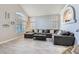 Living room filled with sunlight, and features a large sectional sofa and neutral tones at 2418 Antler Point Dr, Henderson, NV 89074