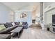 Bright and airy living room with vaulted ceilings, tile floors, and a comfortable sectional sofa at 2418 Antler Point Dr, Henderson, NV 89074