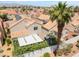Charming home showcasing tile roofing, a covered patio, and a cozy backyard with a playhouse at 2452 Silver Shadow Dr, Las Vegas, NV 89108