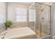 Spa-like bathroom showcasing a soaking tub and walk-in shower at 2452 Silver Shadow Dr, Las Vegas, NV 89108