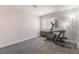 Bedroom with an elliptical machine, a lamp, and carpet flooring at 2452 Silver Shadow Dr, Las Vegas, NV 89108