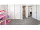 Spacious bedroom with gray carpet, a closet, and an open doorway to the hallway at 2452 Silver Shadow Dr, Las Vegas, NV 89108