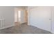 Cozy bedroom with gray carpet, a closet, and an open doorway at 2452 Silver Shadow Dr, Las Vegas, NV 89108