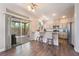 Well-lit kitchen with granite countertops, breakfast bar seating, and an adjacent outdoor area for dining and entertainment at 2452 Silver Shadow Dr, Las Vegas, NV 89108