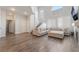 Spacious living room with high ceilings, modern flooring, and a comfortable sectional sofa, perfect for relaxation at 2452 Silver Shadow Dr, Las Vegas, NV 89108
