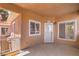 Private balcony entry featuring a secure door, bright windows, and exterior lighting at 251 S Green Valley Pkwy # 1421, Henderson, NV 89012