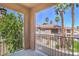 View from private balcony overlooking lush landscaping, mature palm trees, and surrounding buildings at 251 S Green Valley Pkwy # 1421, Henderson, NV 89012