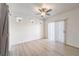 Bright bedroom with wood-look floors and a sliding barn door to a closet at 251 S Green Valley Pkwy # 1421, Henderson, NV 89012