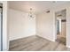 Open dining area with modern lighting, wood-look flooring, and easy access to the kitchen at 251 S Green Valley Pkwy # 1421, Henderson, NV 89012