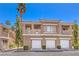 Well-maintained condo exterior with private garages, balconies, and lush landscaping in a desirable community at 251 S Green Valley Pkwy # 1421, Henderson, NV 89012