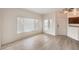 Bright living room with wood-look floors, plenty of natural light, and neutral paint at 251 S Green Valley Pkwy # 1421, Henderson, NV 89012