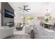 Modern, virtually staged living area with fireplace, dining area, and open-concept layout at 2553 Showcase Dr, Las Vegas, NV 89134