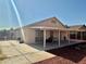Home's backyard with covered patio and secure privacy fence at 2621 Blue Reef Dr, North Las Vegas, NV 89032
