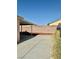 Backyard featuring a cement patio and a tall brick perimeter wall at 2621 Blue Reef Dr, North Las Vegas, NV 89032