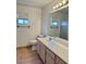 The bathroom has a large vanity and modern lighting, providing ample space and illumination at 2621 Blue Reef Dr, North Las Vegas, NV 89032
