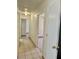View of the hallway with neutral walls and access to rooms, showcasing the home's layout at 2621 Blue Reef Dr, North Las Vegas, NV 89032