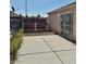 Gated entrance to the backyard adjacent to the exterior side door at 2621 Blue Reef Dr, North Las Vegas, NV 89032