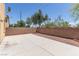 Fenced-in backyard patio area with decorative rock surround, landscaping and sunny sky at 3037 Austin Pale Ave, North Las Vegas, NV 89081