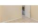 Neutral bedroom with tile floors and a view into the laundry area at 3037 Austin Pale Ave, North Las Vegas, NV 89081