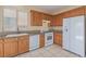 Functional kitchen featuring white appliances, ample counter space, and tile backsplash at 3037 Austin Pale Ave, North Las Vegas, NV 89081