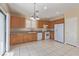 Well-equipped kitchen with sleek appliances, wooden cabinets, and tile flooring at 3037 Austin Pale Ave, North Las Vegas, NV 89081