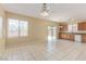 Open living room flows into the kitchen, with tile flooring and access to the backyard at 3037 Austin Pale Ave, North Las Vegas, NV 89081