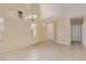 Spacious open-concept living room with tile floors, high ceilings, and natural light at 3037 Austin Pale Ave, North Las Vegas, NV 89081