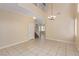 Bright living area features an open floorplan, high ceiling, staircase, and tile flooring at 3037 Austin Pale Ave, North Las Vegas, NV 89081