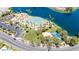 Overhead shot of community featuring a pool, basketball court, parking, and green space by the water at 3151 Soaring Gulls Dr # 2121, Las Vegas, NV 89128