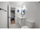 Well-lit bathroom features modern fixtures, a vanity with storage, and a convenient closet at 3151 Soaring Gulls Dr # 2121, Las Vegas, NV 89128