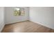 Spacious bedroom features wood-look flooring and natural light; a blank canvas for customization at 3151 Soaring Gulls Dr # 2121, Las Vegas, NV 89128