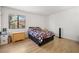 This bedroom features wood-look floors and a bright window view at 3151 Soaring Gulls Dr # 2121, Las Vegas, NV 89128