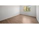 Bright bedroom featuring wood-look floors and a window bringing in natural light at 3151 Soaring Gulls Dr # 2121, Las Vegas, NV 89128