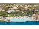 Aerial view of community beach with palm trees and waterfront homes at 3151 Soaring Gulls Dr # 2121, Las Vegas, NV 89128