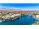 A waterfront area with a bridge, boat dock, and commercial buildings near a lake at 3151 Soaring Gulls Dr # 2121, Las Vegas, NV 89128