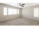 Large bedroom showcasing neutral walls, carpet flooring, and window with blinds at 3209 Cheltenham St, Las Vegas, NV 89129